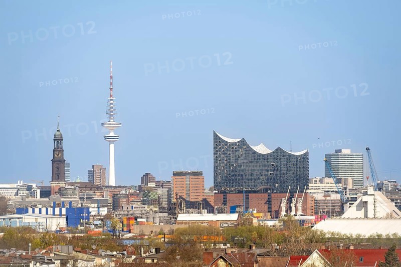 Skyline of Hamburg with St Michael's Church (Michel), Elbe Philharmonic Hall and Heinrich-Herz-Tower in front of a blue sky, Hamburg, Germany
