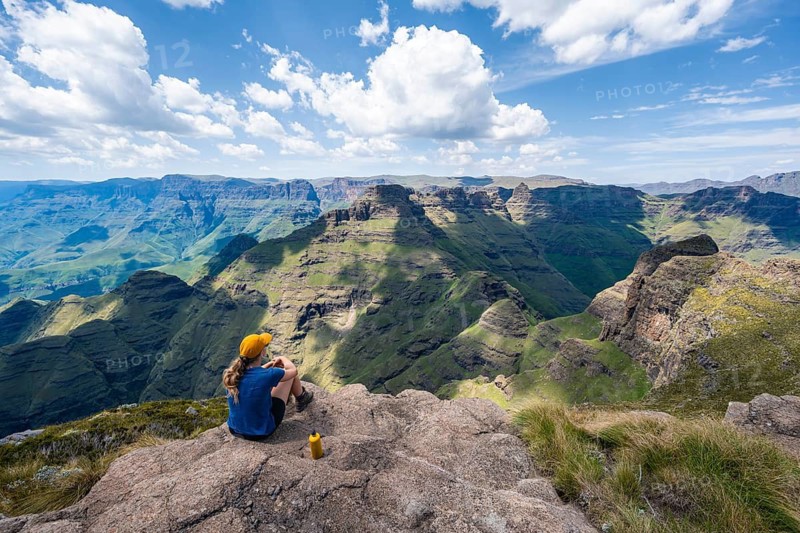 Female mountaineer at the summit of Cathedral Peak or Cathedralpiek or Mponjwana, Drakensberg, KwaZulu-Natal, South Africa