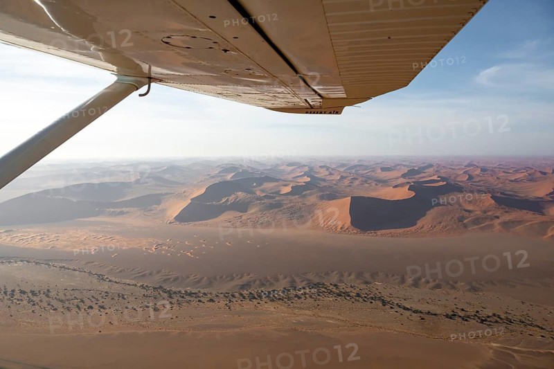 Aerial view from the plane, red sand dunes of the Namib Desert, Namib Naukluft Park, Namibia