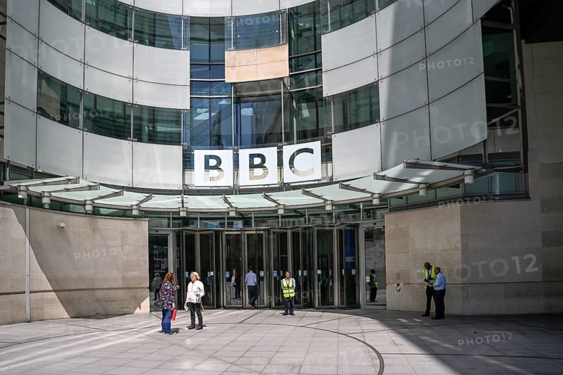 Entrance area of the BBC Broadcasting House with the distinctive curved glass façade and the BBC logo, Portland Place, City of Westminster, London, England, Great Britain, Great Britain