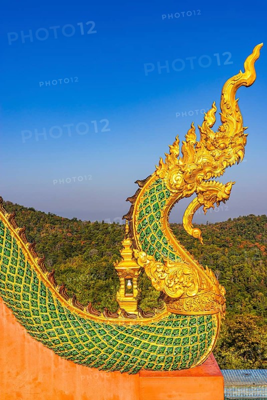 Gilded dragon figure at the stairway to the Buddhist temple Wat Phra That Don Phra Chan, near Lampang, Lampang province, Thailand