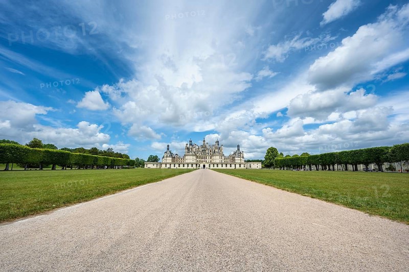 Southeast view of the monumental Renaissance Château de Chambord castle with its distinctive, richly decorated roof silhouette of numerous towers, chimneys and dormers, Chambord Castle, Blois Arrondissement, Loir-et-Cher department, Centre-Val de Loire region, France