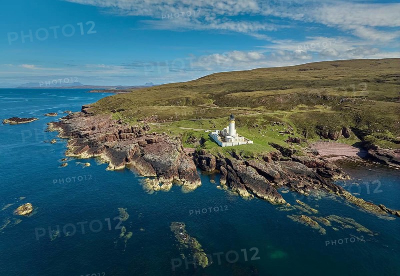 Aerial photo of the lighthouse on the rocky red cliffs of Rua Reidh point, Gairloch, Scotland, UK