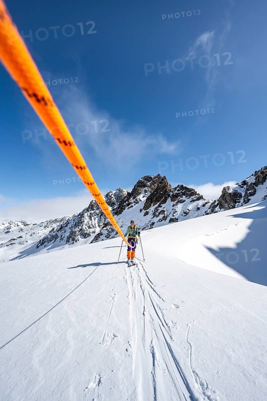 Ski tourer with rope, rope team on the Vadret da Porchabella glacier on the ascent to the summit of Piz Kesch, mountain landscape in winter, alpine tour, ski tour Bündner Haute Route, Albula Alps, Rhaetian Alps, Grisons, Eastern Switzerland, Switzerland