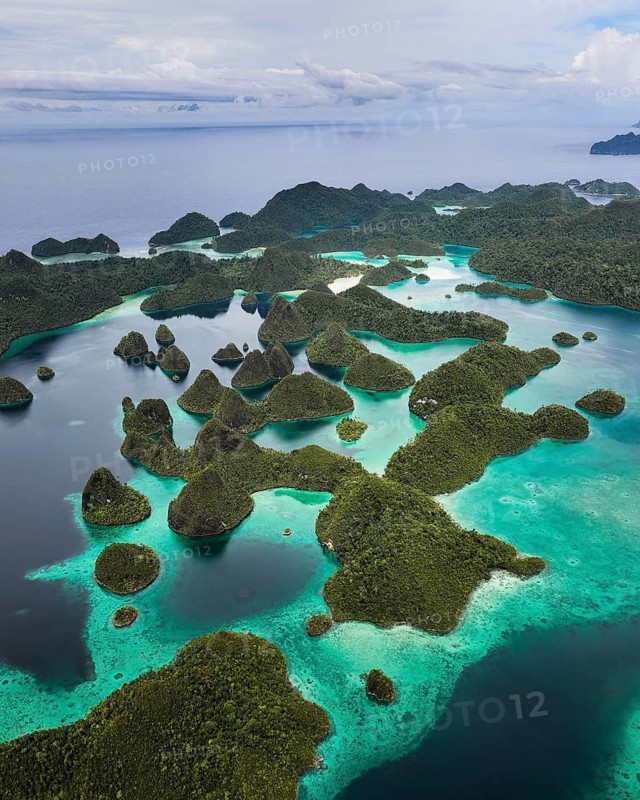 Aerial view of tropical islands and turquoise lagoons, Wayag Archipelagio, West Papua, Indonesia