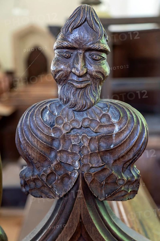 Carved wooden poppyhead face of man with beard, village parish church of Saint Andrew, Winston, Suffolk, England, UK
