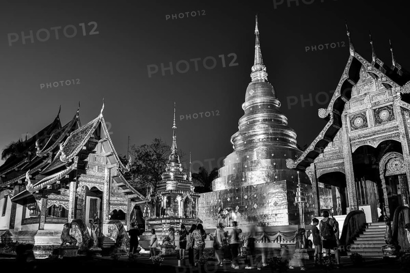 Chiang Mai, Thailand - 15th february, 2024: visitors explore Wat Phra Sing - Buddhist temple .Tha Luang Road in Tambon Wiang, Mueang district, Chiang Rai northern Thailand. Background banner monochrome