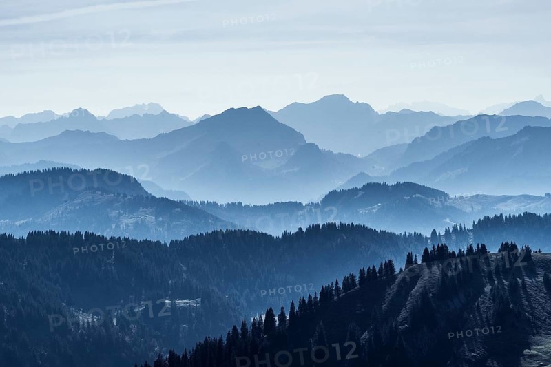 Moody mountain landscape with the mountains of Bregenzer Wald, Vorarlberg, Austria