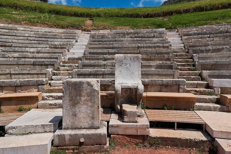 Ancient rows of stone amphitheatre in front of green landscape, ancient site, archaeological site, Messene, Messini, Messinia, southwest of the Peloponnese, odyssey, Odyssey, Odysseus, Ulysses, film, filming location, Matt Damon, Peloponnese, peninsula, Greece