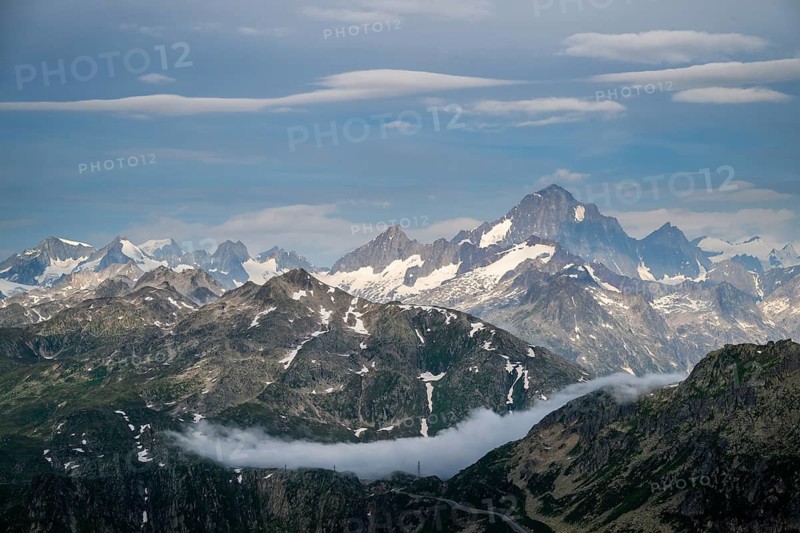 Mountain landscape with clouds of fog, Valais, Switzerland