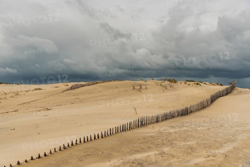 Emerging storm in sunshine in the dunes on the Atlantic coast, Soulac-sur-Mer, France