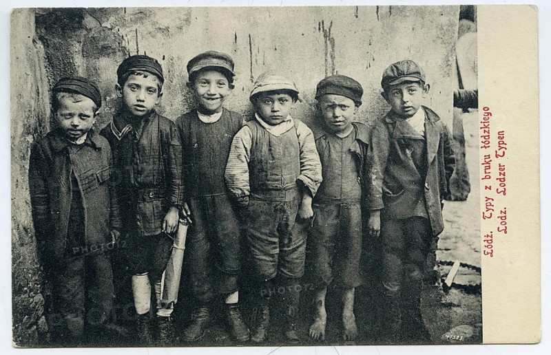 Lodz, Poland, boys, Jewish children, A group of six children in old-fashioned clothing posing side by side on a street, 1915
