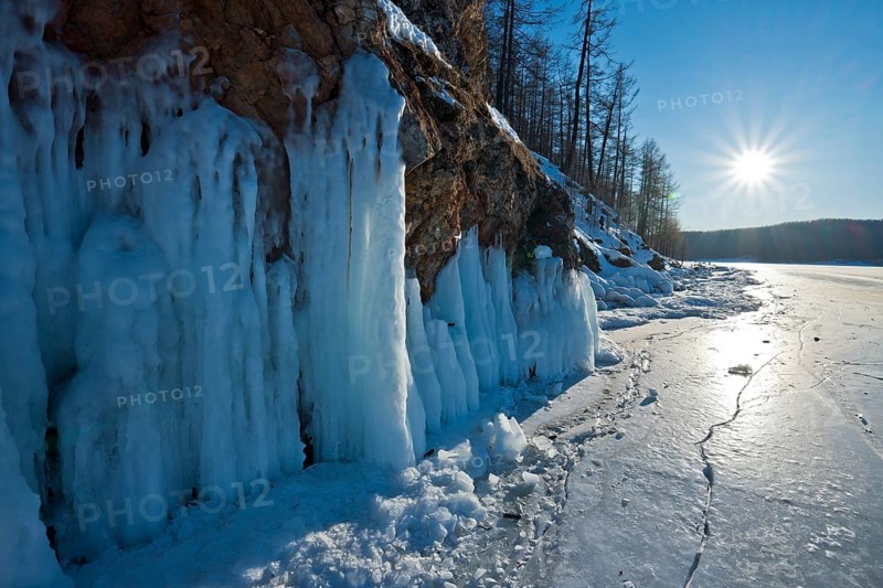 The icy winter sun at minus 27 degrees Celsius, the metre-thick frozen surface of Lake Khövsgöl Nuur, Lake Khuvsgul, Chöwsgöl Aimag (also known as Lake Khuvsgul, Chöwsgöl Aimag (also Khuvsgul or Khövsgöl), Northern Mongolia, Mongolia
