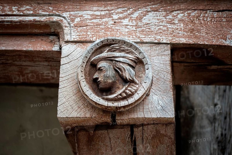 Historic wood relief, profile portrait of a man on a support beam of a historic half-timbered building in the old town of Troyes, Aube department, Grand Est region, France