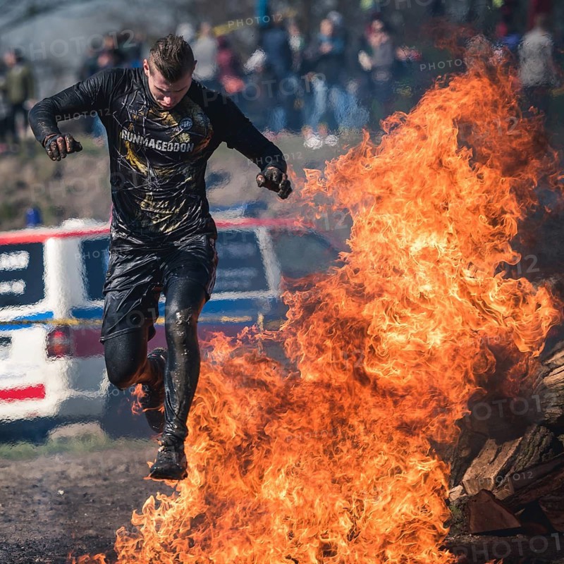 WROCLAW, POLAND - APRIL 7, 2018: Extreme running with obstacle RUNMAGEDDON. In the picture a runner on the Recruit route