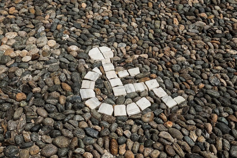 Pebble mosaic, wheelchair, disabled, parking lot, parking space for the disabled, Freiburg im Breisgau, Baden-Württemberg, Germany