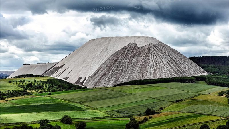 View of Monte Kali, 05.06.2026. pegs. White landmarks visible from afar rise in the Werra Valley, created by potash mining, Heringen, Hesse, Germany