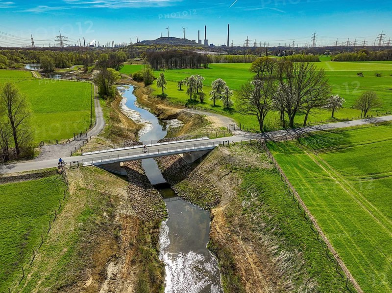 Dorsten, North Rhine-Westphalia, Germany - Renaturalised Rapphofs (also Rapphoffs) Mühlenbach, tributary of the Lippe, Lippe system, behind the Oberscholven wind farm slagheap in Gelsenkirchen. Expansion of the area for flood protection during heavy rainfall and for biodiversity. The previously straightened stream is given curves again and can meander through its new floodplain