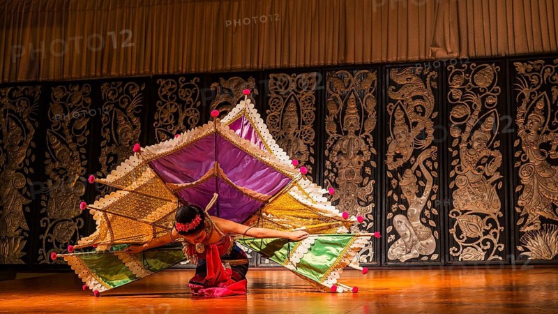 Young Thai woman with fan-like wings showing a traditional dance, Old Chiang Mai Cultural Center, Chiang Mai, Thailand