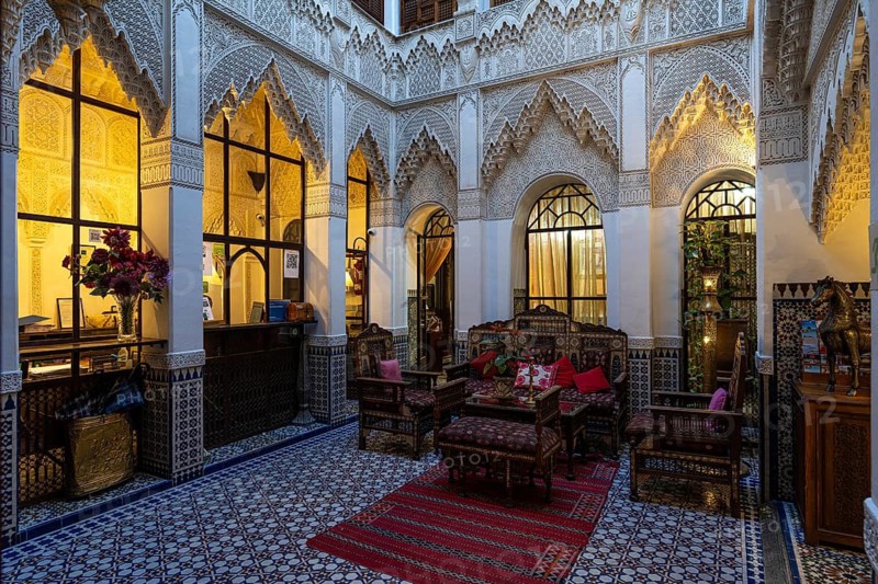Oriental courtyard with carpet and beautiful furnishings at Hotel Riad Palais Sebhan, former city palace, Medina, Marrakech, Maghreb, North Africa, Morocco