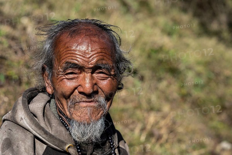 Portrait, elderly Nepalese man, native of the Tsumba Tibetan ethnic group, Tsum Valley, Himalayas, Nepal