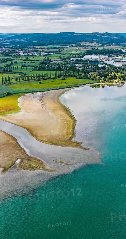 The Radolfzeller Aach flows into Lake Constance. The river carries little water. The water level in Lake Constance is at a low level due to the hot summer. In many ports in the Untersee, there is barely any water left. moss is located on the shores of Lake Constance on the Höri peninsula. aerial view. moss, Baden-Württemberg, Germany