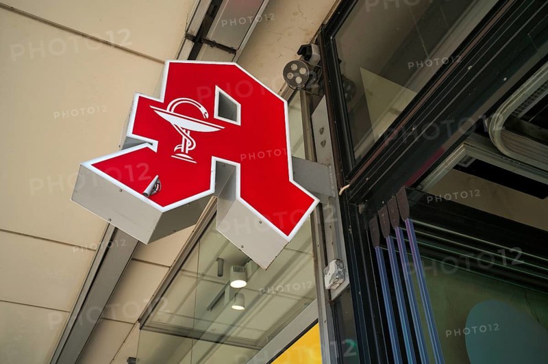 Logo, red neon sign, pharmacy sign with Aesculapian stick, Aesculapian stick, Stuttgart, Baden-Württemberg, Germany