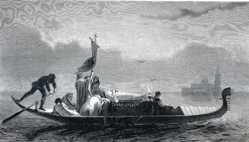 The selected picture shows a historic Venetian funeral gondola, from the 19th century on its way to the cemetery island of San Michele in Italy. The traditional Venetian boat carries the laid coffin in the center, which is decorated with flower wreaths. A single death lamp burns at the head end, authentic, high-resolution reproduction from a 19th century original, exact date of depiction unknown, historical
