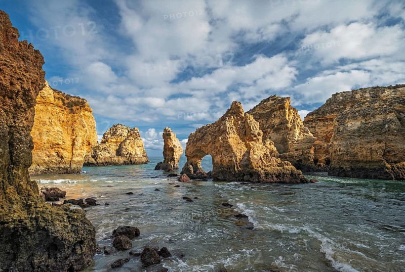 Ponte da Piedade in Lagos, Algarve, Portugal, has golden ocean cliffs, rock arches and sea stacks near shore