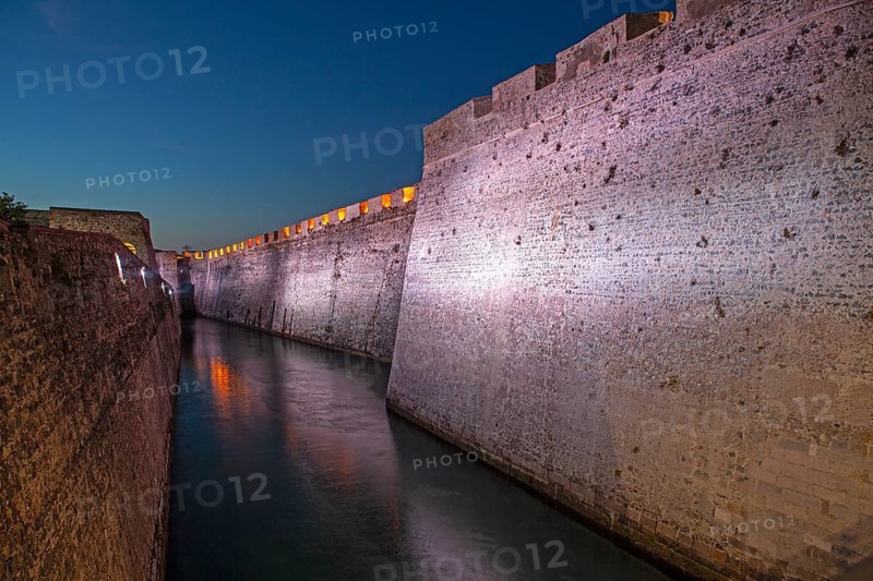 Lights illuminate the Royal moat in the Royal Walls ensemble, Ceuta, Spain, North AfricaMurallas Reales, Ceuta