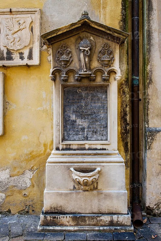 Historic tomb and epitaph of the Kirchlechner family on the north side of the parish church of St. Nicholas in the old town of Merano, South Tyrol, Italy