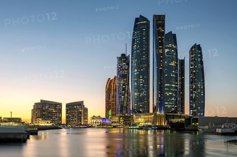 Abu Dhabi Skyline Etihad Towers skyscrapers at night in Abu Dhabi, United Arab Emirates