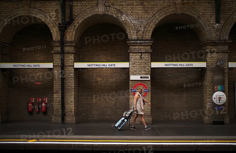 Travelers, Notting Hill Gate subway station, underground, tube, public transport, London, England, Great Britain, Great Britain