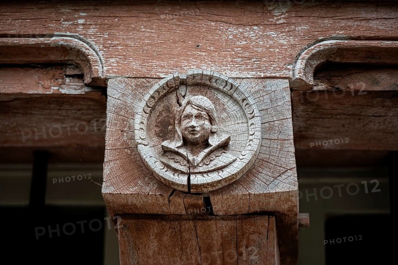 Historic wood relief, profile portrait of a young man on a support beam of a historic half-timbered building in the old town of Troyes, Aube department, Grand Est region, France