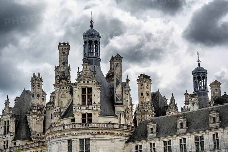 Detailed view of the monumental Renaissance Château de Chambord castle with its distinctive, richly decorated roof silhouette of numerous towers, chimneys and dormers, Chambord Castle, Blois Arrondissement, Loir-et-Cher department, Centre-Val de Loire region, France