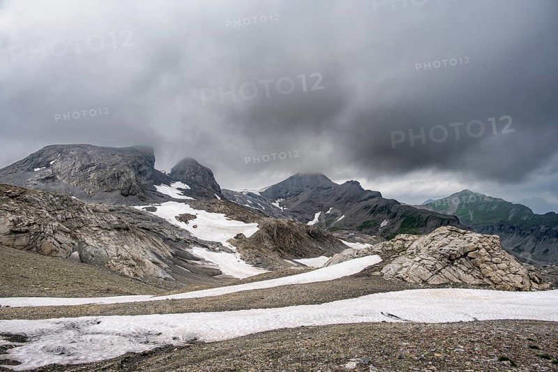 Bare rocky mountain landscape with remnants of snow in bad weather, Rote Härd, Bernese Alps, Bernese Oberland, Switzerland