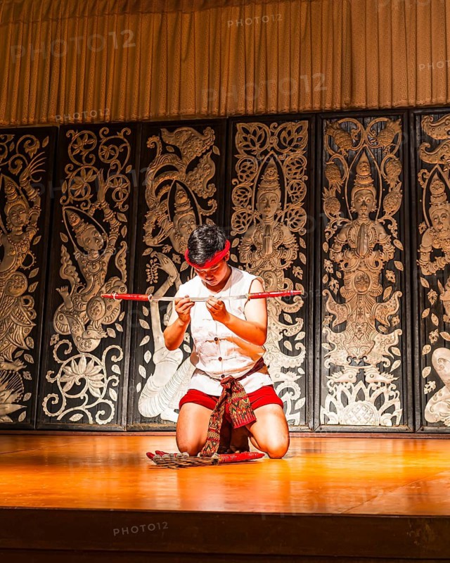 Young Thai man in traditional clothing in a historic show with knives and swords, Old Chiang Mai Cultural Center, Chiang Mai, Thailand