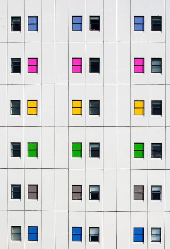 Colourful windows patterning a modern apartment facade, Christchurch, New Zealand