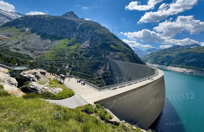 View from an elevated location at the 200-meter high Kölnbrein dam highest dam in Austria, 1933 meters above sea level. Side facing away from the water on the left air side, Kölnbreinspeicher reservoir with reservoir, Malta Valley, Carinthia, Austria