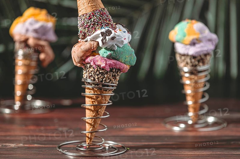 Ice cream cones with colorful ice cream, decorated with sprinkles