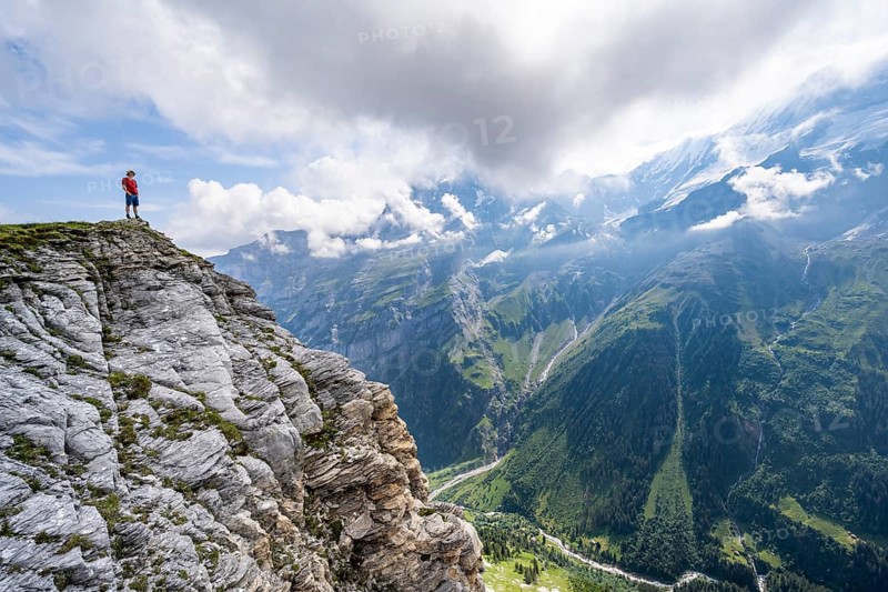 Mountaineers in front of picturesque mountain scenery at the summit of Tanzbödeli, Bernese Alps, Bernese Oberland, Switzerland