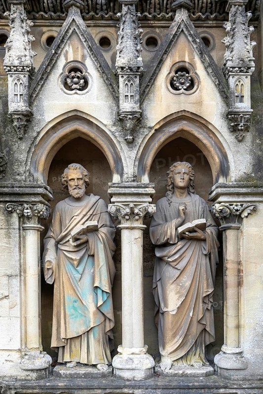 Stone statues of saints Luke and John, parish church of St John the Baptist, Frome, Somerset, England, UK sculptor James Forsyth 1860s