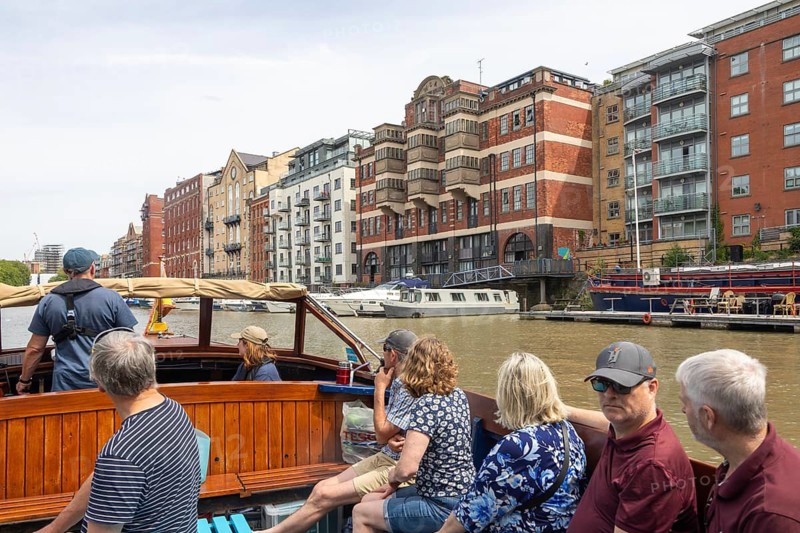 Passengers onboard boat trip on the Floating Harbour, River Avon, Bristol, England, UK