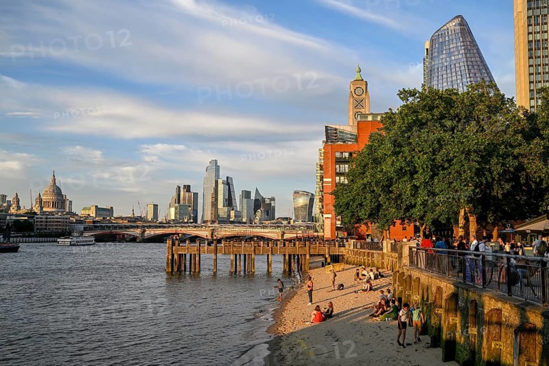Sandy beach beach on the banks of the Thames near Gabriel's Wharf with views of Blackfriars Bridge and the City of London skyline with skyscrapers 22 Bishopsgate, Leadenhall Building, Cheesegrater, and 20 Fenchurch Street, Walkie Talkie, South Bank, London, England, Great Britain, Great Britain