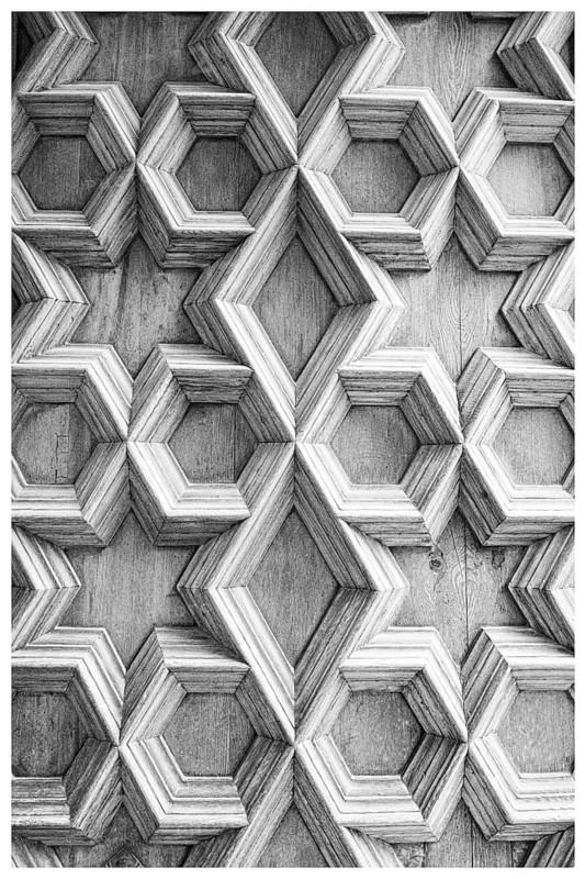 Ornamentation on a wooden door at the Silk Exchange (Lonja de la Seda) in Valencia, Spain