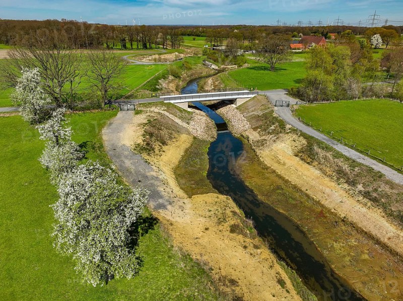 Dorsten, North Rhine-Westphalia, Germany - Renaturalised Rapphofs (also Rapphoffs) Mühlenbach, tributary of the Lippe, Lippe system, area expansion for flood protection during heavy rainfall and for biodiversity. The previously straightened stream is given curves again and can meander through its new floodplain