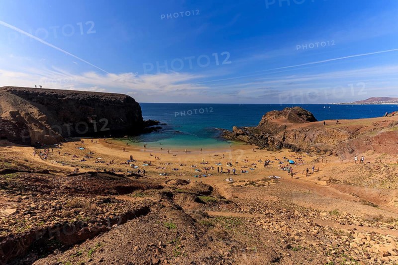 Lanzarote, Canary Islands, Spain, Europe, Playas de las Papagayo, sandy beach surrounded by rocks and blue sea under a clear sky