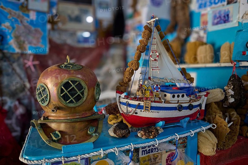 Diving helmet and model boat on a blue exhibition with sponges and maritime themes, Sponge Maufaktur, Nikolas Gourlas, Pothia, main town, port, Kalymnos, Sponge Diving Island, Dodecanese, Greek Islands, Greece