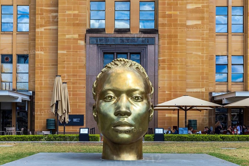 A bronze sculpture head named Ancient Feelings by Thomas J Price outside the Museum of Contemporary Art, Sydney, Australia