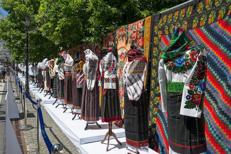 Exhibition of traditional clothing with colorful outdoor tapestries, folklore festival, Chisinau, Chisinau, Chisinau, Republic of Moldova, Moldova, Eastern Europe